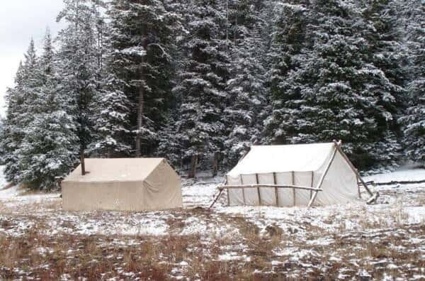 Wall tents set up in s meadow at a hunting Camp