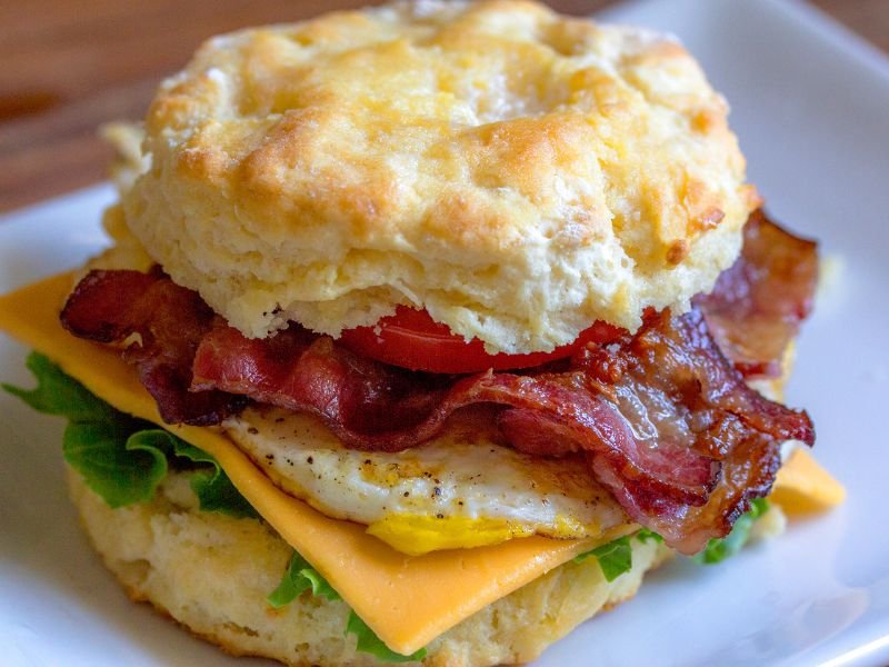 delicious egg and bacon biscuit breakfast sandwich