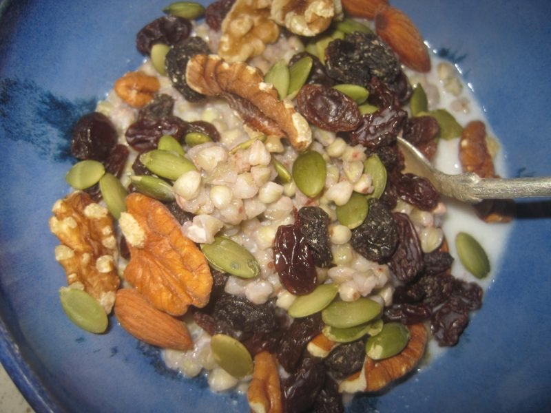 Bowl of Nuts, Seeds and Raisins with cooked Buckwheat