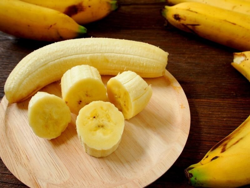 chunks of bananas on a wooden cutting board
