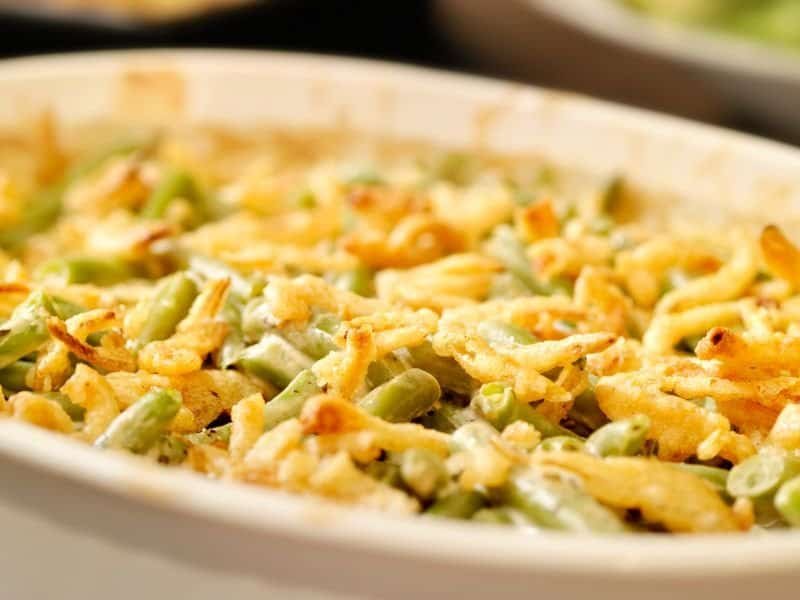 Green bean casserole with crispy fried onions and savory flavors.
