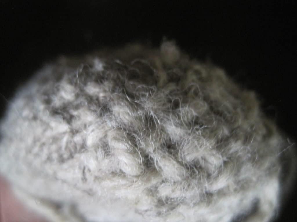 mended hole in the heel of a wool sock