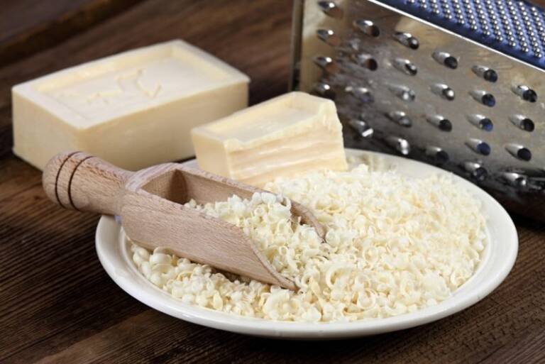 homemade laundry soap shavings and a metal grater