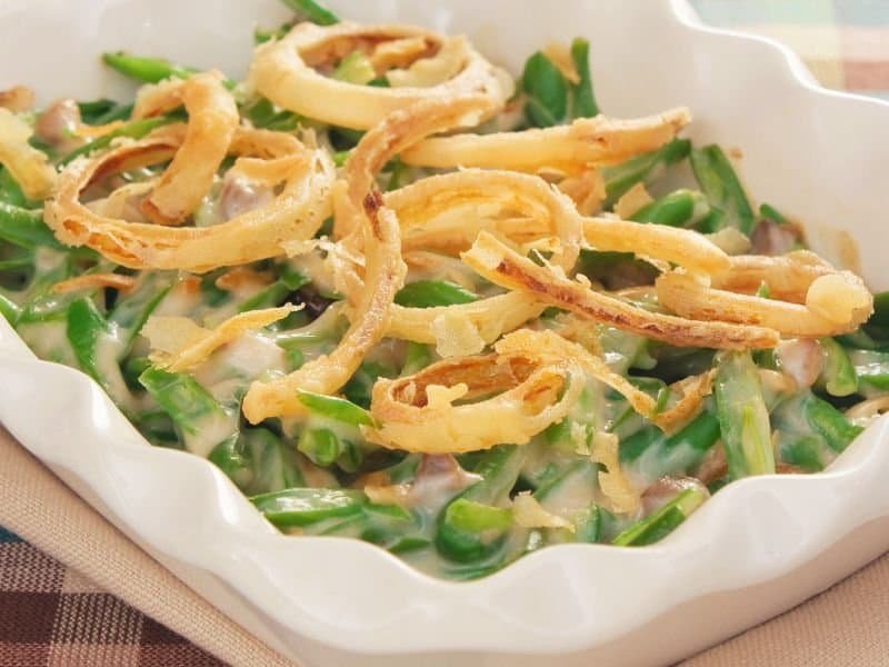 Green bean casserole with crispy fried onions and savory flavors.