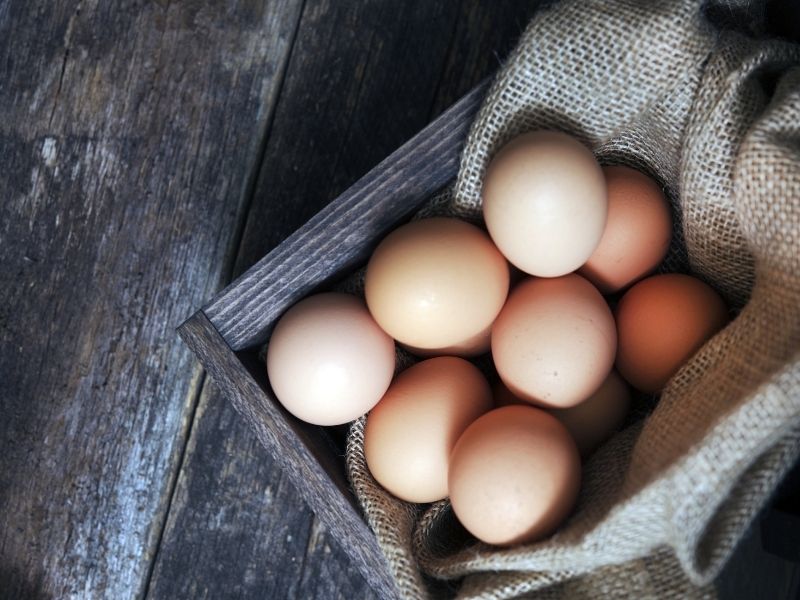fresh eggs in a wooden crate