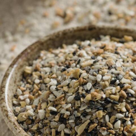 a mixture of spices and seeds in a bowl for Everything Bagel Mix