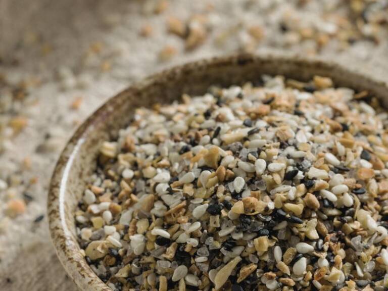 a mixture of spices and seeds in a bowl for Everything Bagel Mix