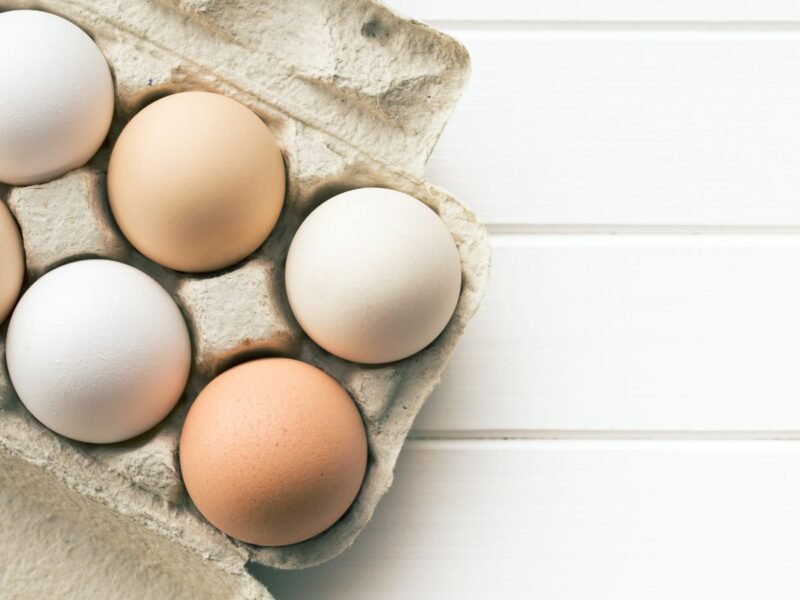 farm fresh eggs in a carton on a table