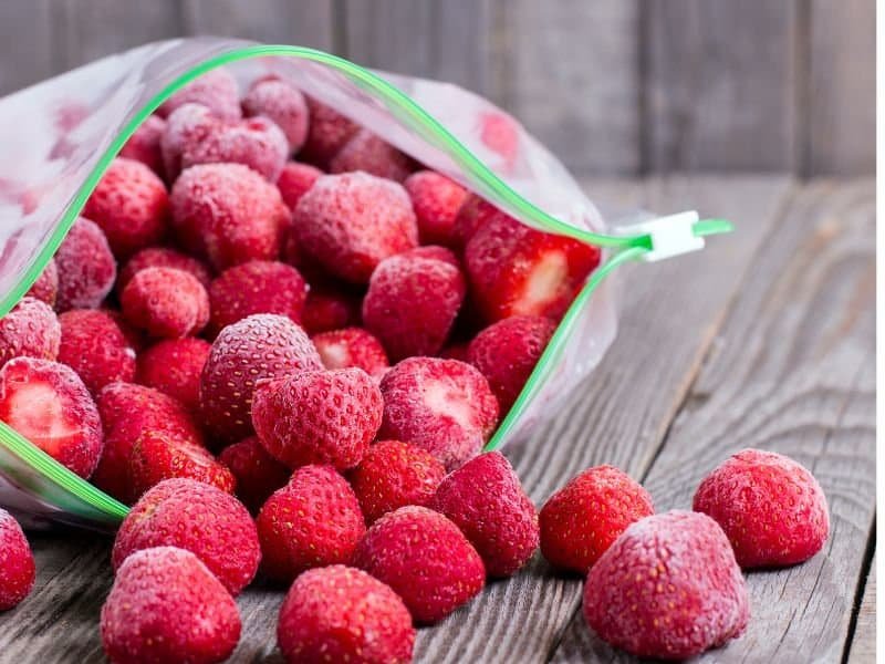 frozen strawberries in a quart size bag on a table