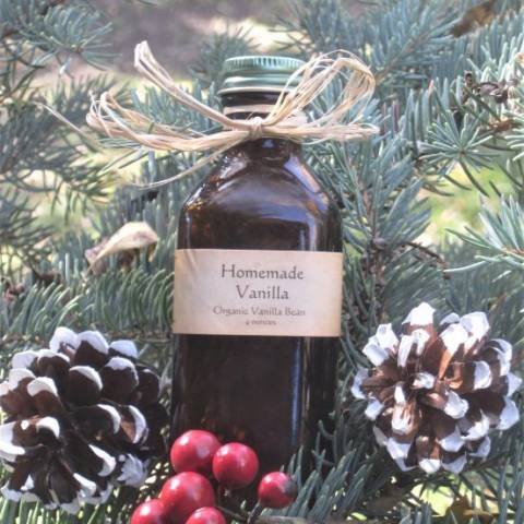 Homemade Vanilla in a little 4 ounce brown bottle with frosted pinecone décor