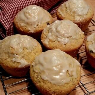 Homemade Poppy Seed and Lemon Muffins with Blueberries on a wired cooling rack