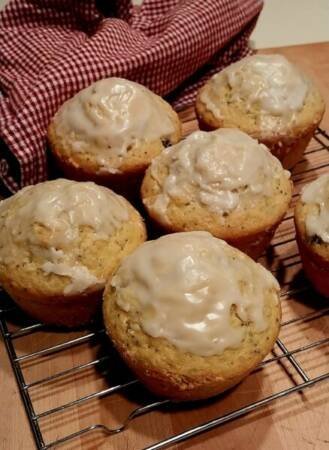 Homemade Poppy Seed and Lemon Muffins with Blueberries on a wired cooling rack