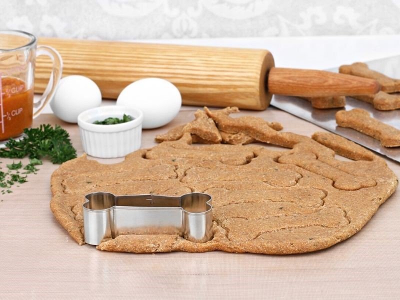rolling out doggie cookies with a rolling pin