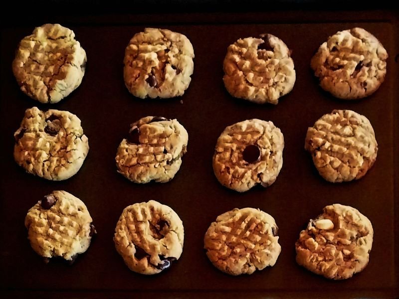 freshly baked chocolate chip cookies on a baking sheet