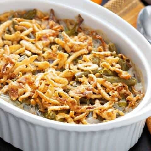 Delicious green bean casserole topped with crispy fried onions, perfect for comfort food meals.