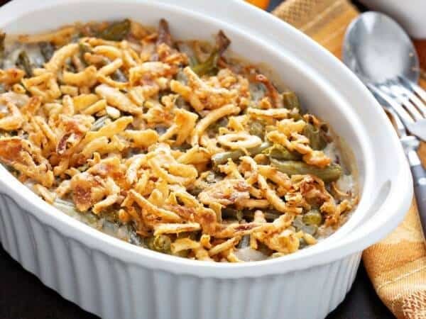 Delicious green bean casserole topped with crispy fried onions, perfect for comfort food meals.