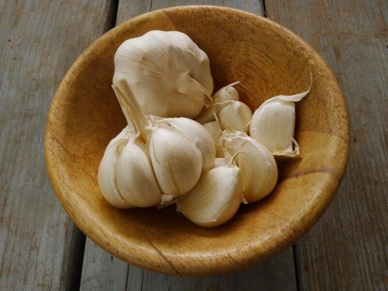 fresh garlic in a wooden bowl