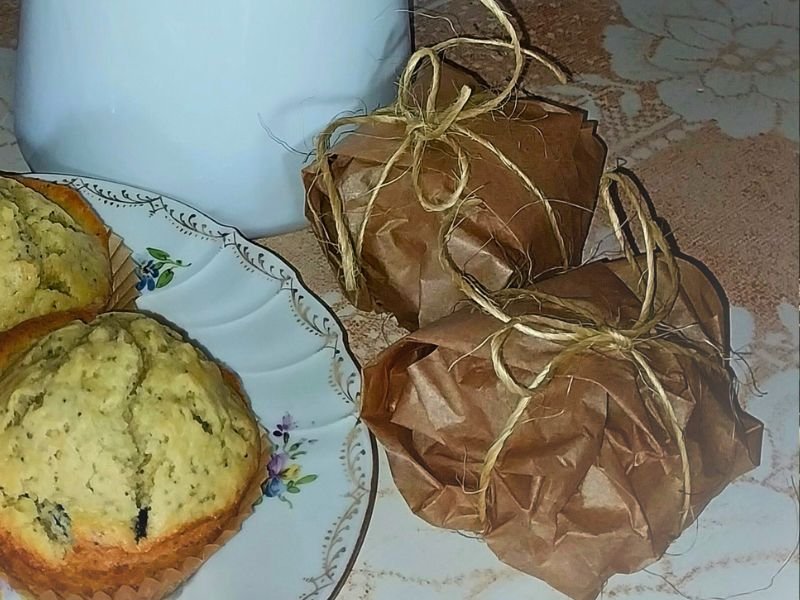 parchment paper wrapped poppy seed muffins ready for a fun little gift!